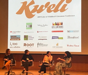 image of four women (unidentified) in on stage seated in chairs during panel at the Kweli Conference