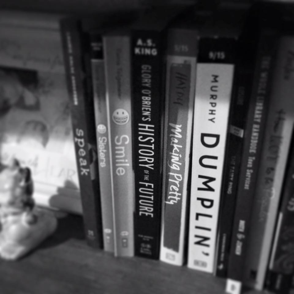 black and white photo of bookshelf with multiple young adult titles