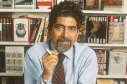 old photo of Sonny Mehta in front of book display shelf