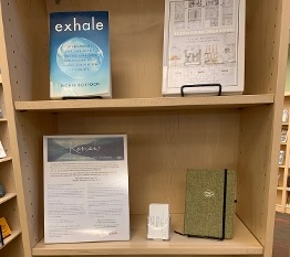 Bookshelf at an Anythink library branch with a collection of wellness titles displayed