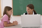 teacher and student with laptop