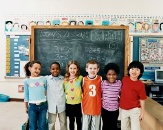 kids in front of a blackboard