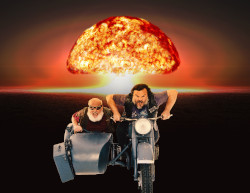 Jack Black driving motorcycle toward viewer with Kyle Gass in a sidecar and an explosion in the background